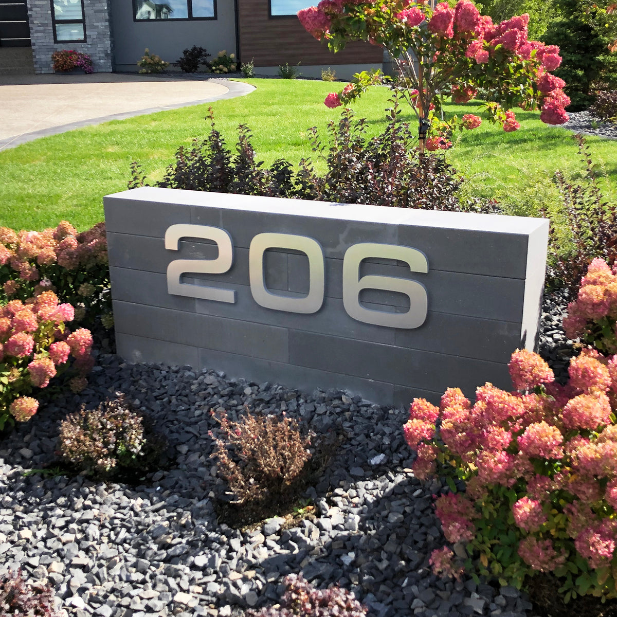 Edmonton Floating House Numbers mounted on landscape feature