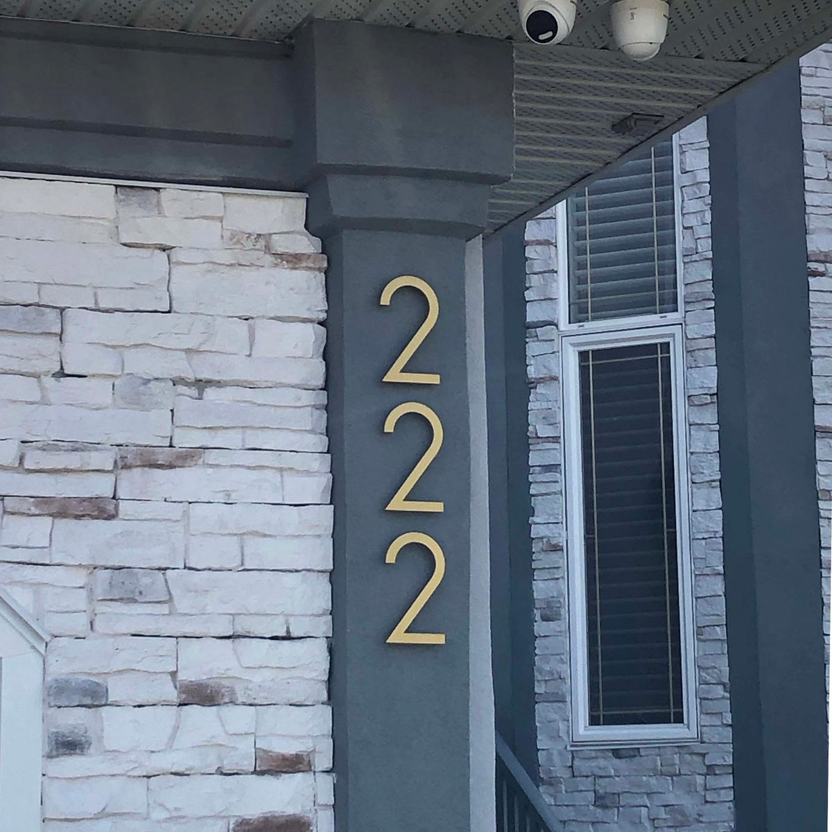 Gold Anodized Floating House Numbers installed on home