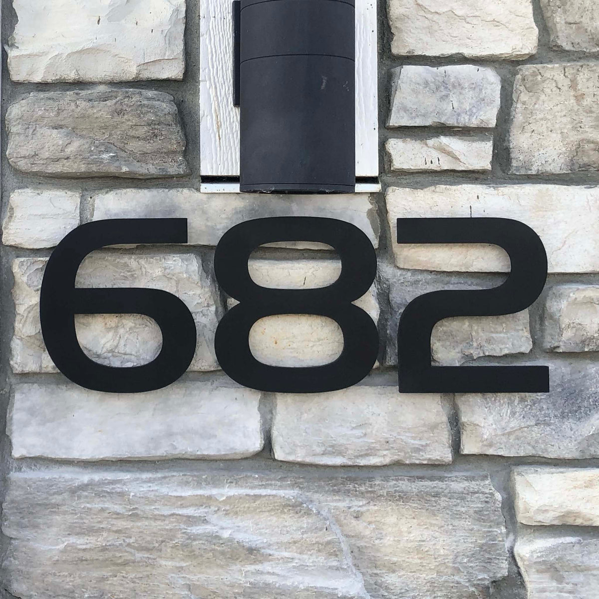 Black Anodized Aluminum House Numbers on Light Stone Facade